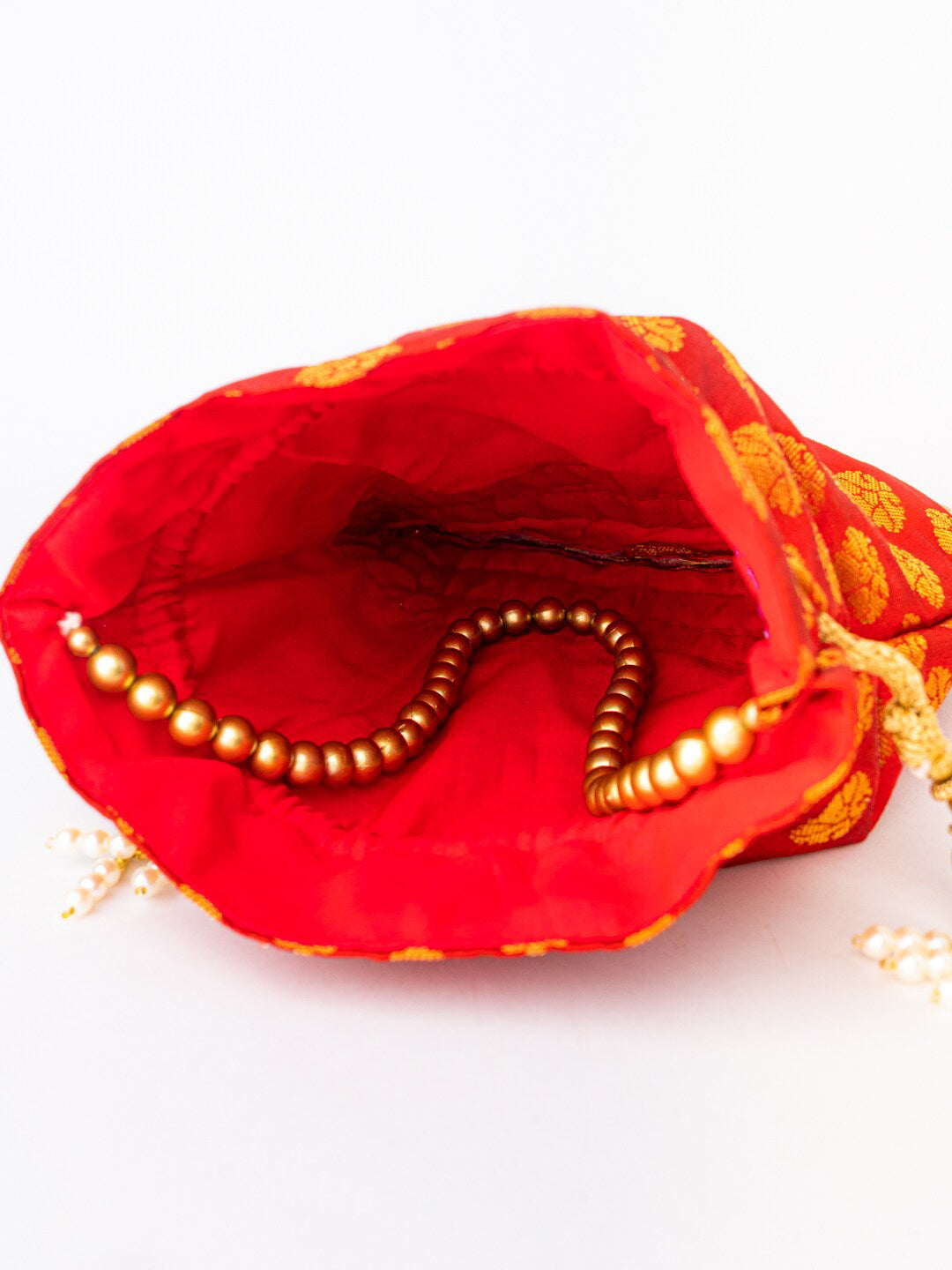 NR By Nidhi Rathi Red & Gold-Toned Embroidered Potli Clutch - Swadesiicart