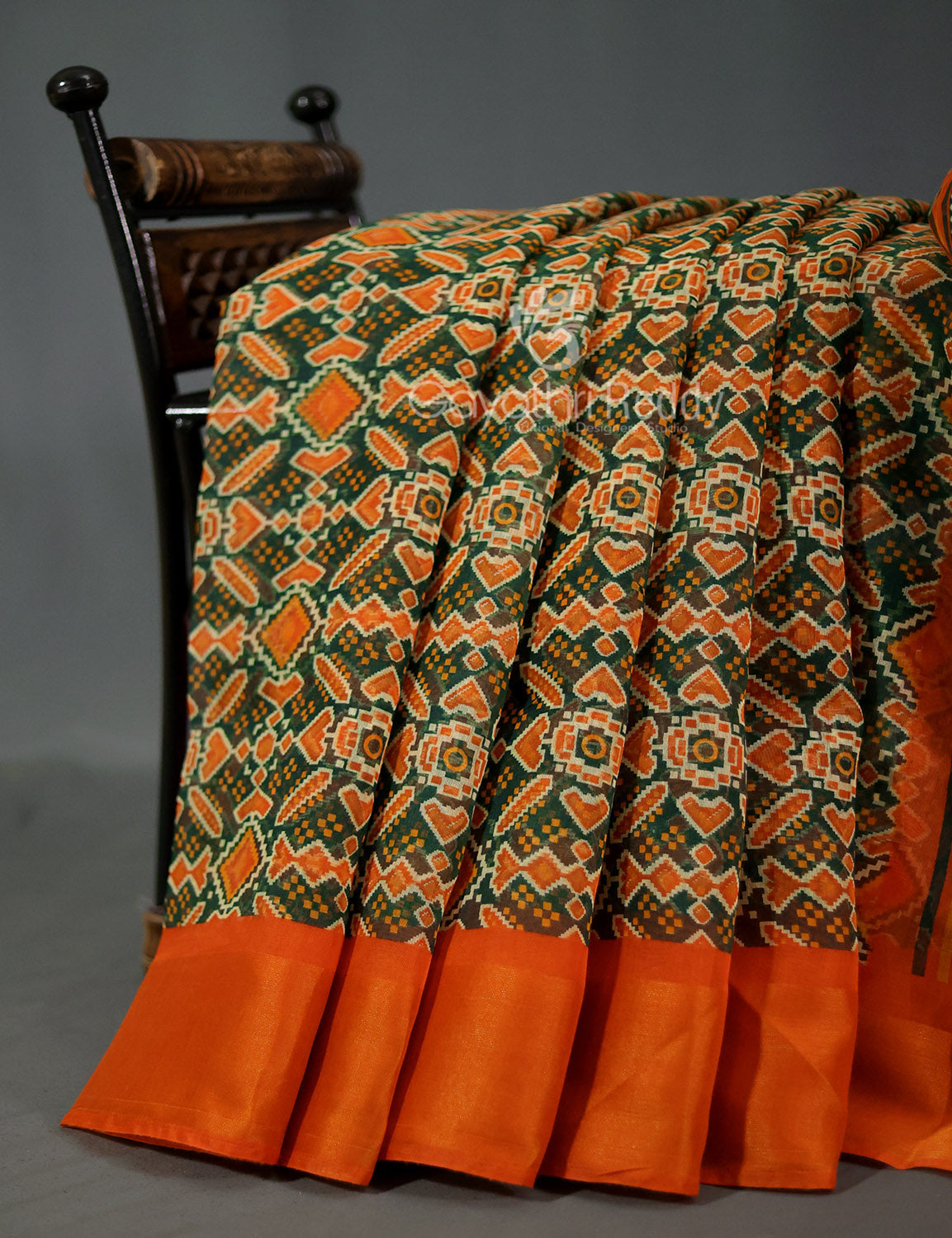 Shades of Dark Green And Orange Colour Patola Print Semi Chanderi Saree By Gayathri Reddy Designer Studio | Swadesiicart