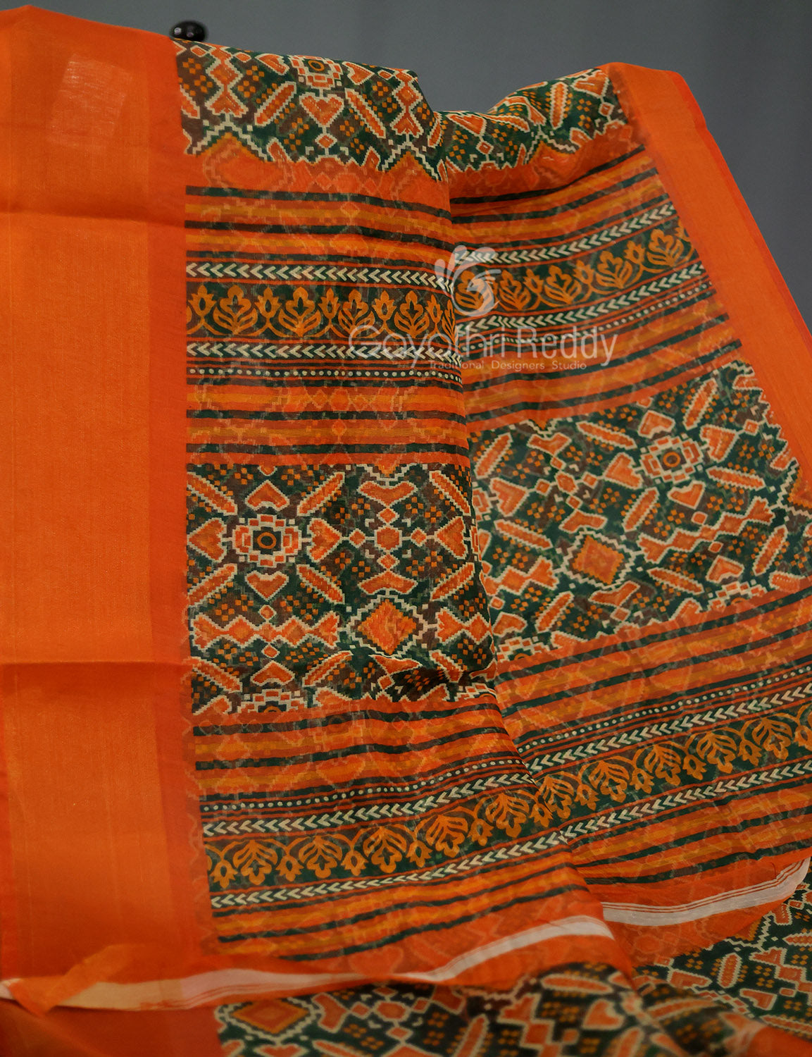 Shades of Dark Green And Orange Colour Patola Print Semi Chanderi Saree By Gayathri Reddy Designer Studio | Swadesiicart