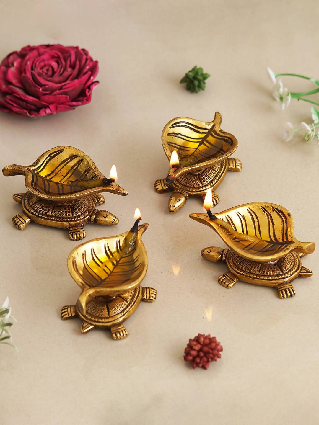 eCraftIndia 4 Pieces Beige Tortoise Statue Leaf Design Diyas | Swadesiicart