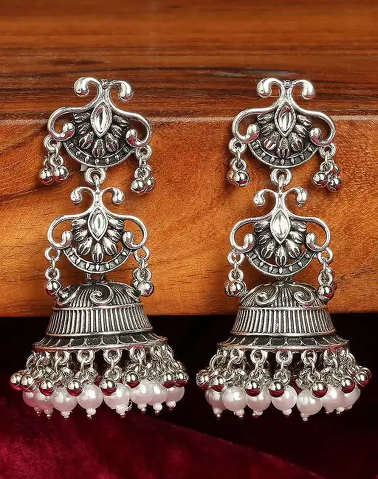 Jewel City Vintage Oxidized Silver Jhumka Earrings with Pearl and Red Bead Accents | Swadesiicart