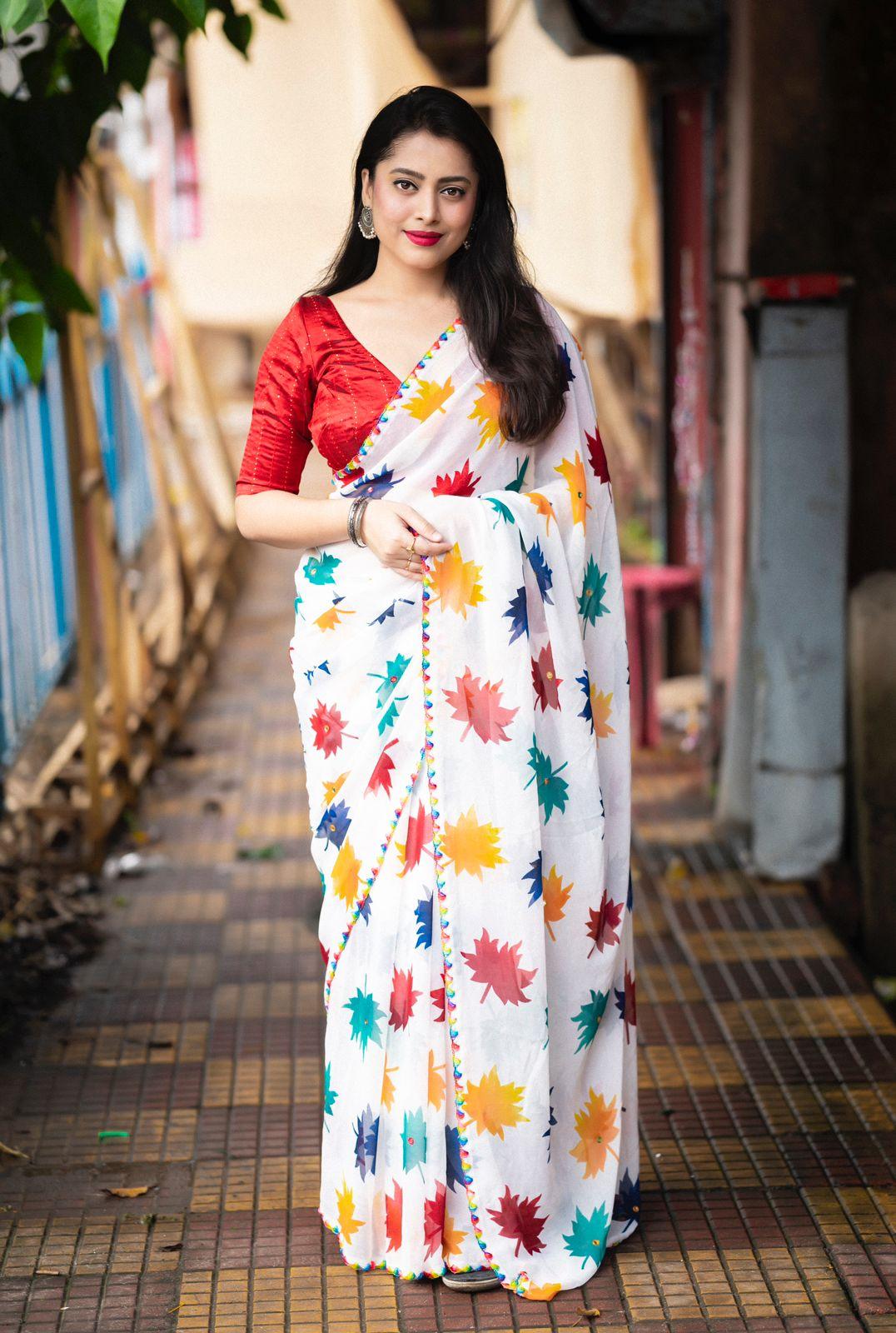 White Poly Georgette Ethnic Motifs Saree with Unstitched Blouse - Hiral Fashion | Swadesiicart