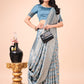 Shree Shyam Fashion Graceful Sky Blue Lichi Silk Saree with Contrast Blue Woven Border & Floral Zari Design - Wedding & Festive Wear