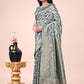 Shree Shyam Fashion Graceful Green Lichi Silk Saree with Contrast Blue Woven Border & Floral Zari Design - Wedding & Festive Wear