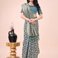 Shree Shyam Fashion Graceful Green Lichi Silk Saree with Contrast Blue Woven Border & Floral Zari Design - Wedding & Festive Wear