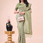 Shree Shyam Fashion Graceful Mehndi Green Lichi Silk Saree with Contrast Blue Woven Border & Floral Zari Design - Wedding & Festive Wear
