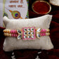 NVR Men Pink & Gold-Toned Kundan-Studded Rakhi With Roli Chawal | Swadesiicart