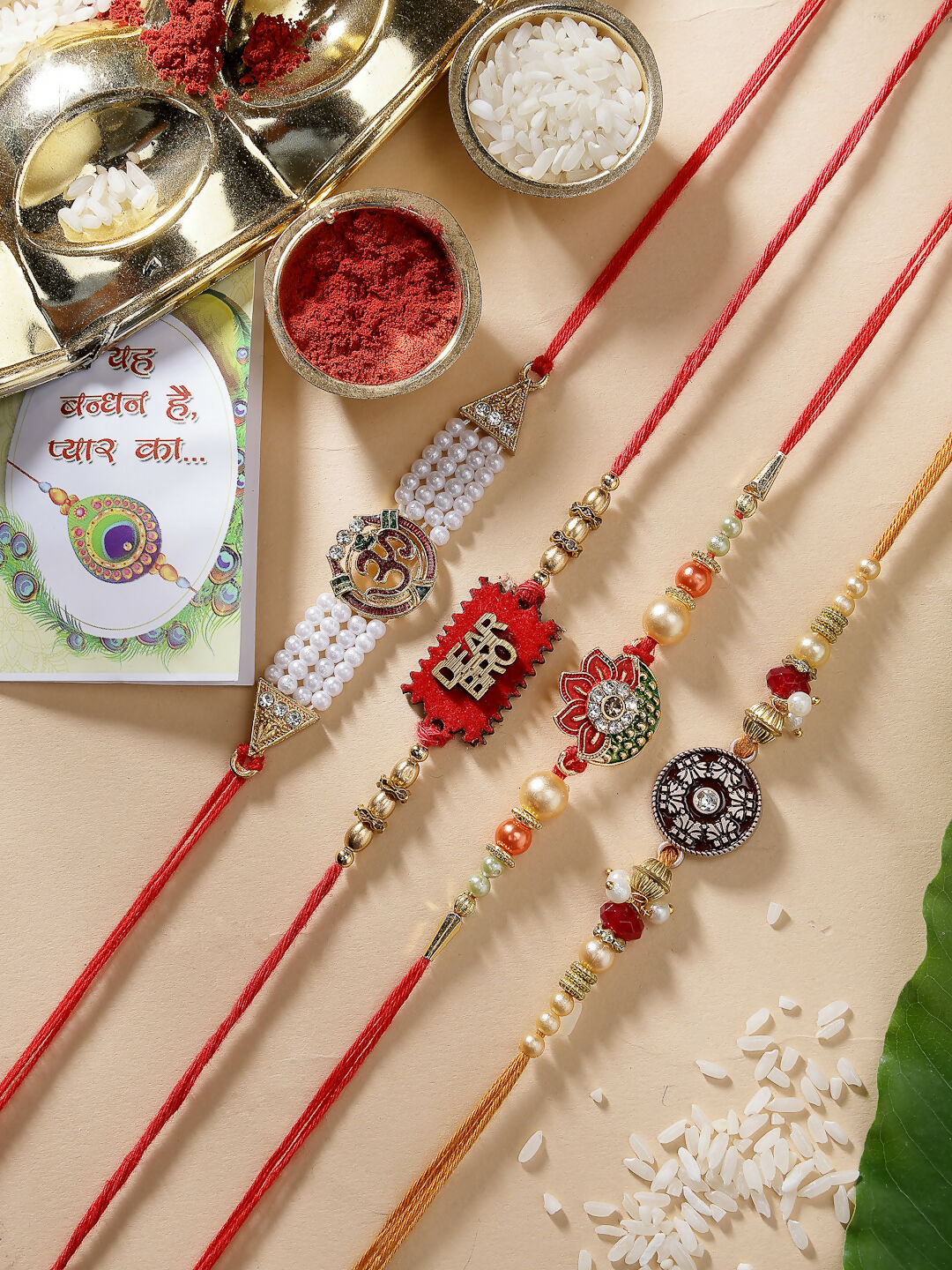 NVR Men Set of 4 Gold-Toned Stone-Studded & Beaded Rakhi With Roli Chawal & Chocolate | Swadesiicart