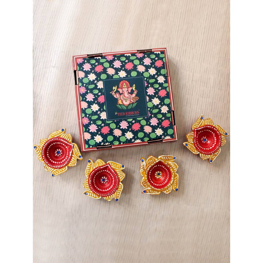 Tied Ribbons Set Of 4 Yellow & Red Printed Terracotta Diyas | Swadesiicart