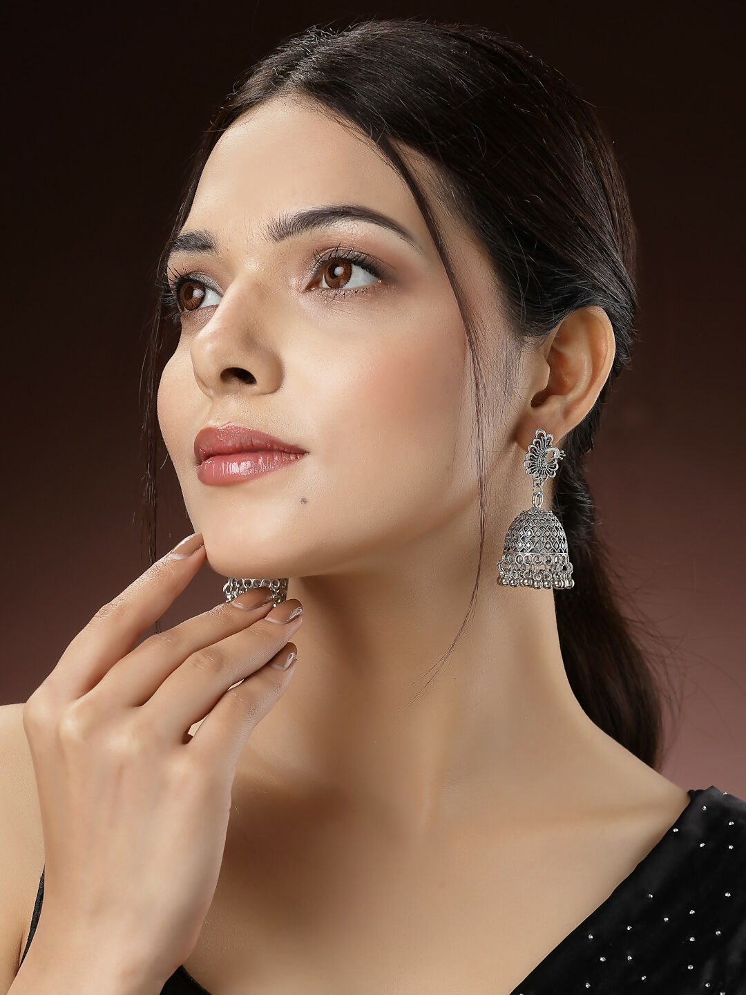 NVR Women's Silver-Toned Peacock Design German Silver Oxidised Dome Shaped Jhumka Earrings | Swadesiicart