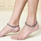 Jewels Nest Traditional Silver-Plated Black Beaded Anklet with Floral Charms | Swadesiicart