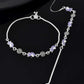 Jewels Nest Set of 2 Silver-Plated Stainless Steel Paisley & Floral Charm Anklets - Swadesiicart
