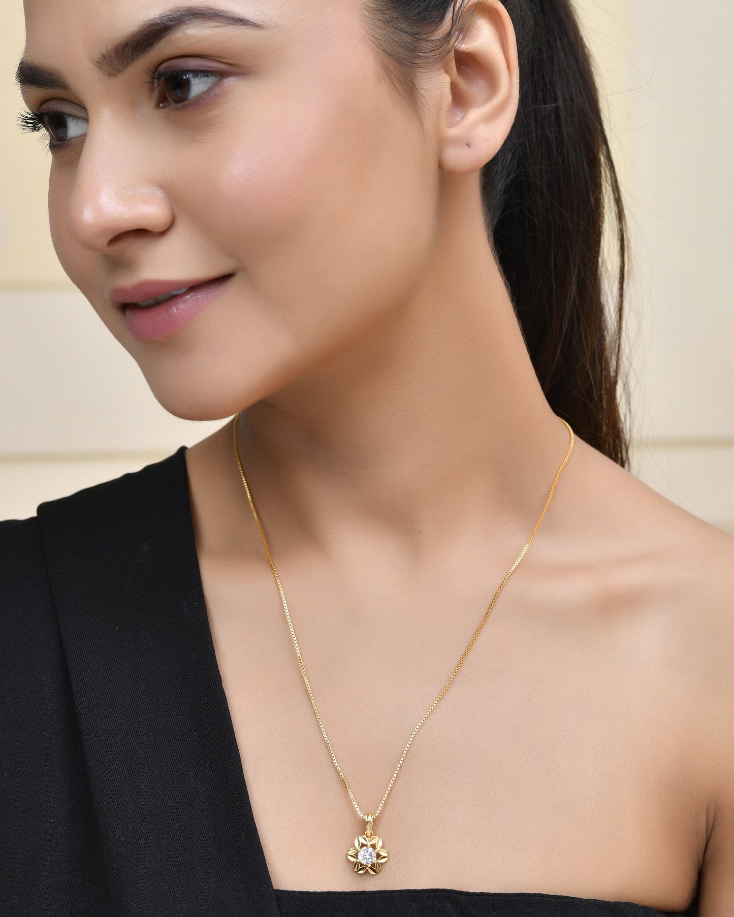Jewels Nest Elegant Gold-Polished Floral Pendant with Sparkling Stone | Swadesiicart