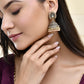 Jewels Nest Antique Gold-Polished Jhumka Earrings with Floral Detailing and Stone Embellishments - Swadesiicart