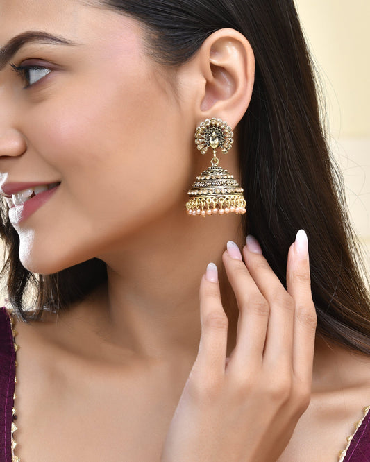Jewels Nest Antique Gold-Polished Jhumka Earrings with Floral Detailing and Stone Embellishments - Swadesiicart