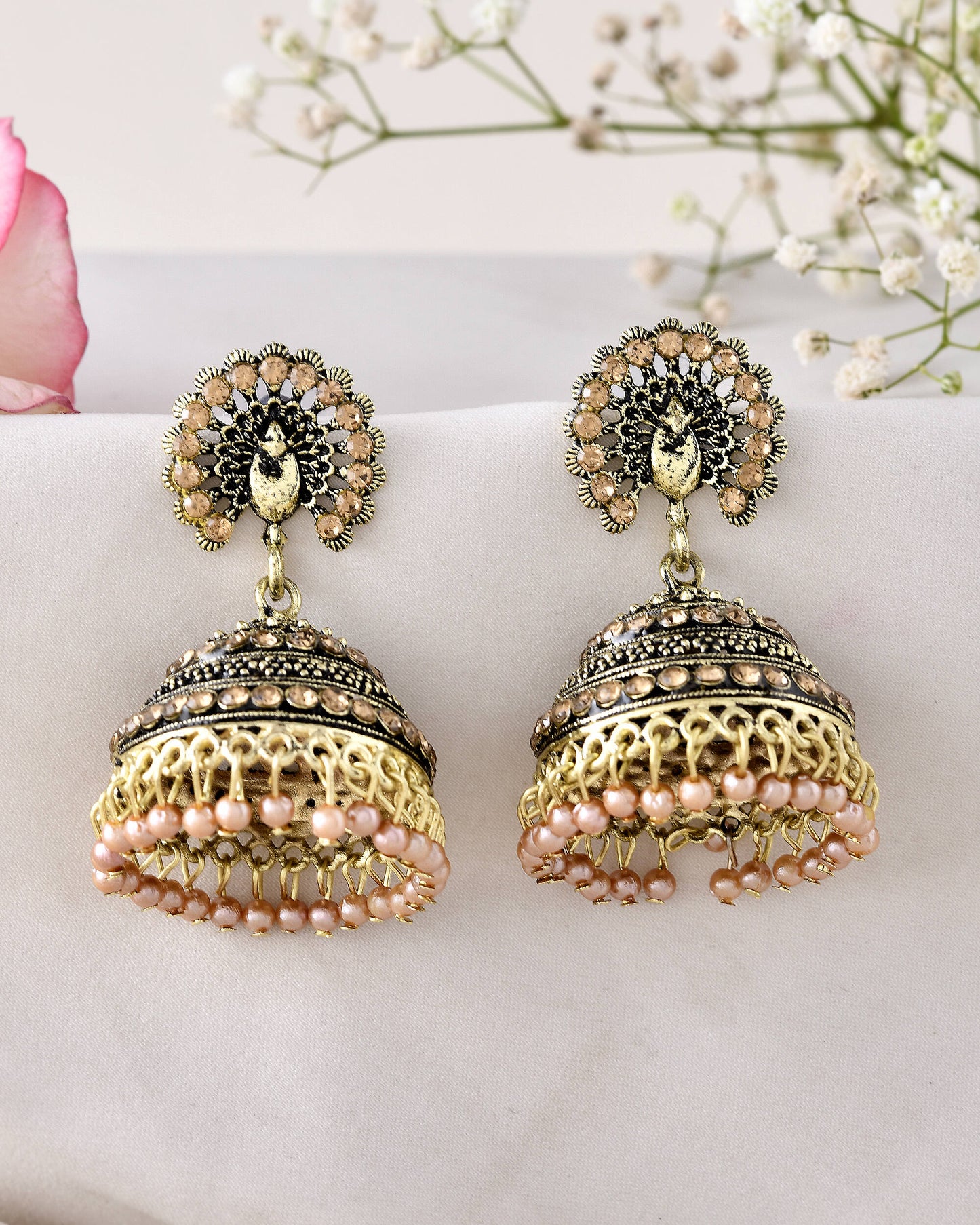 Jewels Nest Antique Gold-Polished Jhumka Earrings with Floral Detailing and Stone Embellishments - Swadesiicart