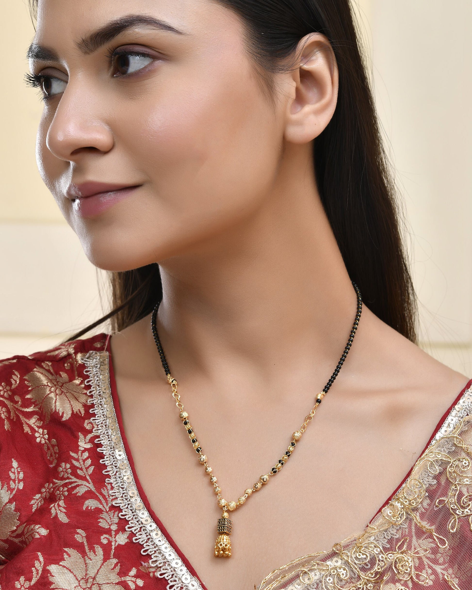 Jewels Nest Graceful Gold-Polished Black Bead Mangal Sutra with Intricate Pendant | Swadesiicart