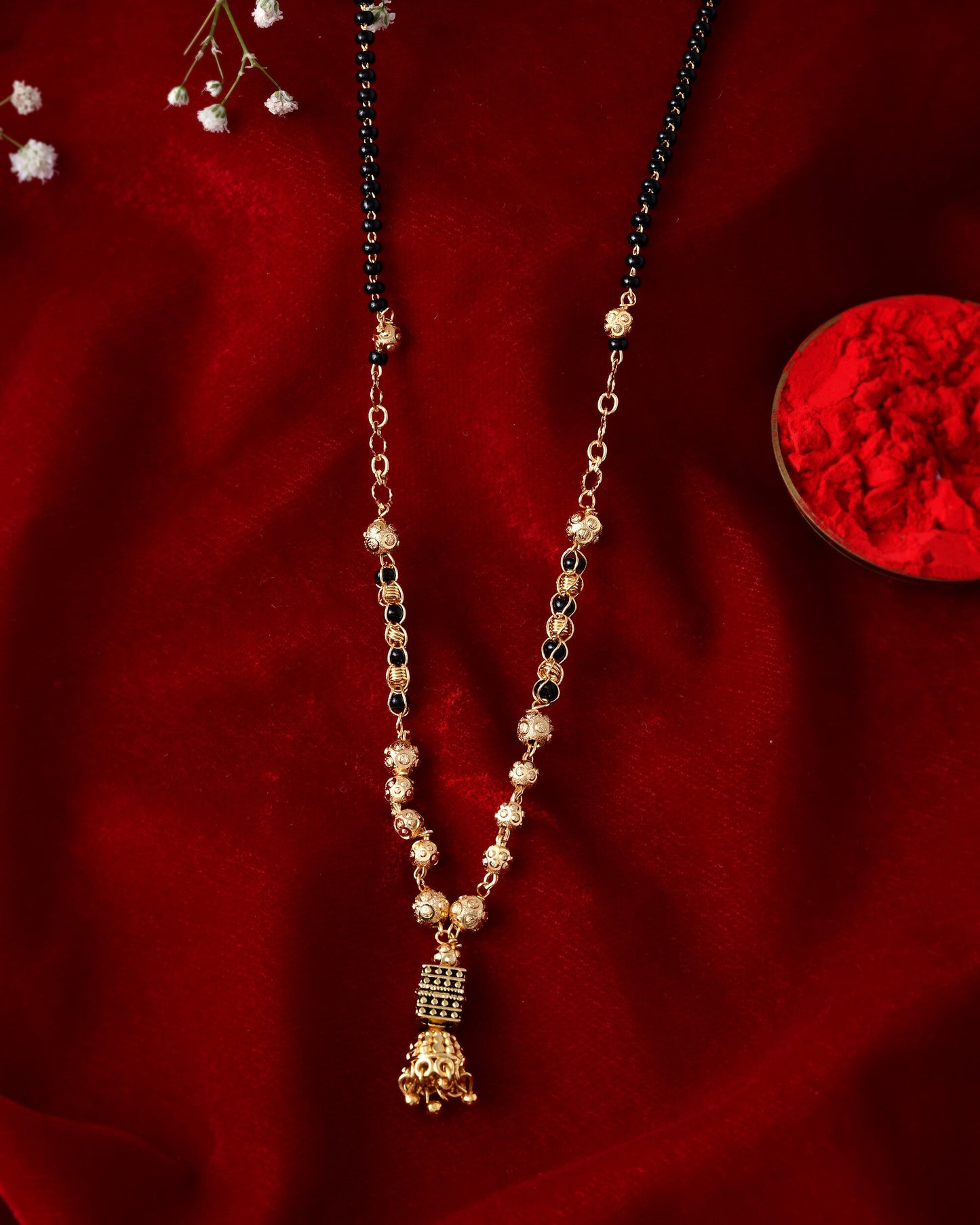 Jewels Nest Graceful Gold-Polished Black Bead Mangal Sutra with Intricate Pendant | Swadesiicart