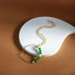 Gold-Polished White Green Stone-Studded Pearl Beaded Nosepin - Ruby Raang | Swadesiicart