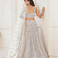 Aastha Fashion Off White Butterfly Net Tone To Tone Thread Work, Sequence Work And Original Mirror Work Embroidery Wedding Wear Lehenga Choli