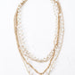 Gold-Polished Alloy Rhinestones And Pearl Layered Necklace - The Pari | Swadesiicart