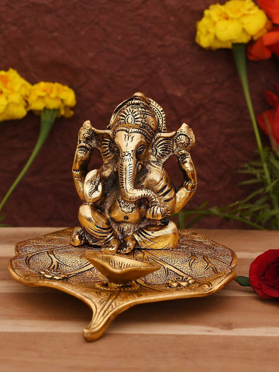 CraftVatika Gold Toned Aluminium Ganesh with Diya Idol | Swadesiicart