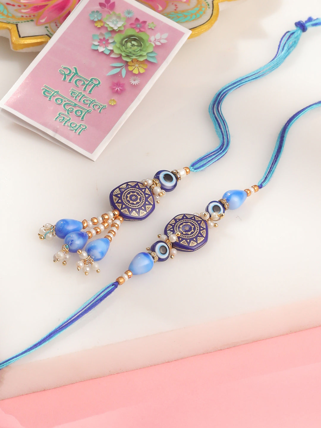 NVR Evil Eye Set of 2 Blue Artificial Beads Bhaiya Bhabhi Rakhi with Roli Chawal Chandan & Mishri | Swadesiicart