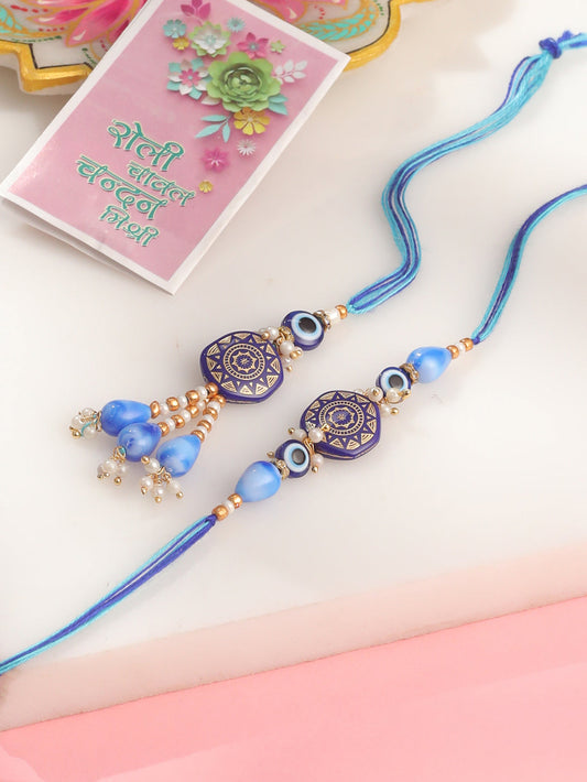 NVR Evil Eye Set of 2 Blue Artificial Beads Bhaiya Bhabhi Rakhi with Roli Chawal Chandan & Mishri | Swadesiicart