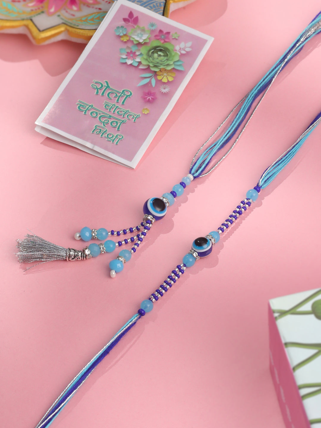 NVR Set of 2 Blue Evil Eye Artificial Beads Bhaiya Bhabhi Rakhi with Roli Chawal Chandan & Mishri - Swadesiicart