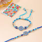 NVR Set of 2 Blue Evil Eye Floral Design Bhaiya Bhabhi Rakhi with Roli Chawal Chandan & Mishri | Swadesiicart