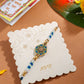 NVR Men Peacock Design Multicolor Artificial Stones & Pearls Thread Rakhi with Roli Chawal Chandan & Mishri | Swadesiicart