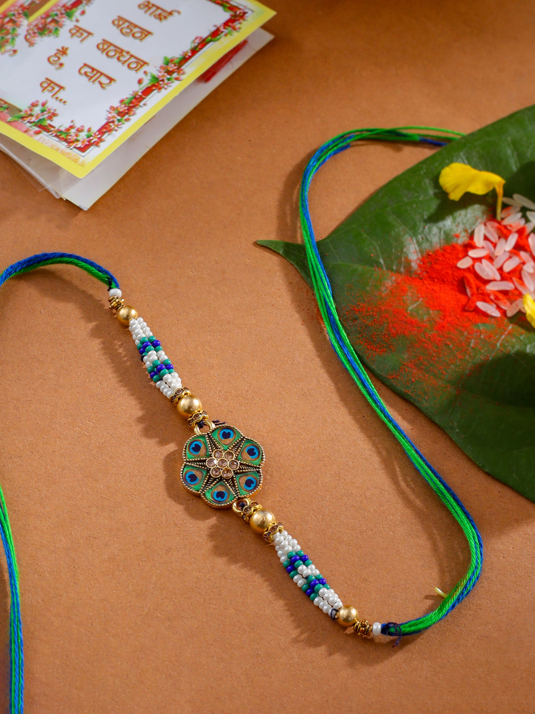 NVR Men Peacock Design Multicolor Artificial Stones & Pearls Thread Rakhi with Roli Chawal Chandan & Mishri | Swadesiicart