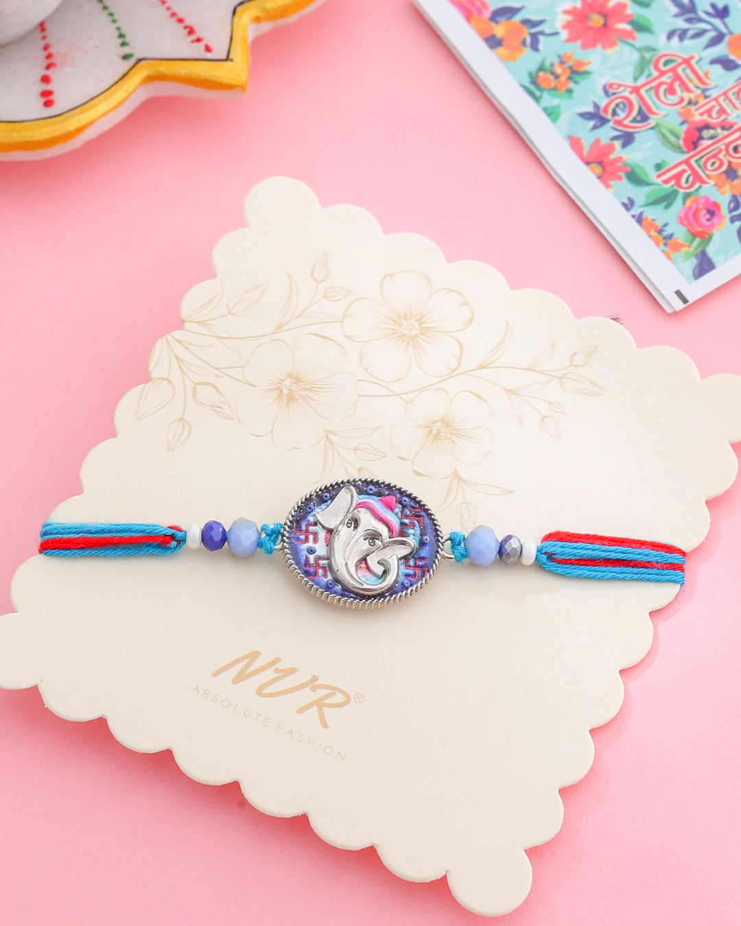 NVR Men Red & Blue Ganesh Ji Thread Rakhi with Roli Chawal Chandan & Mishri - Swadesiicart