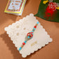 NVR Men Red & Blue Artificial Stones and Beads Om Thread Rakhi with Roli Chawal Chandan & Mishri - Swadesiicart