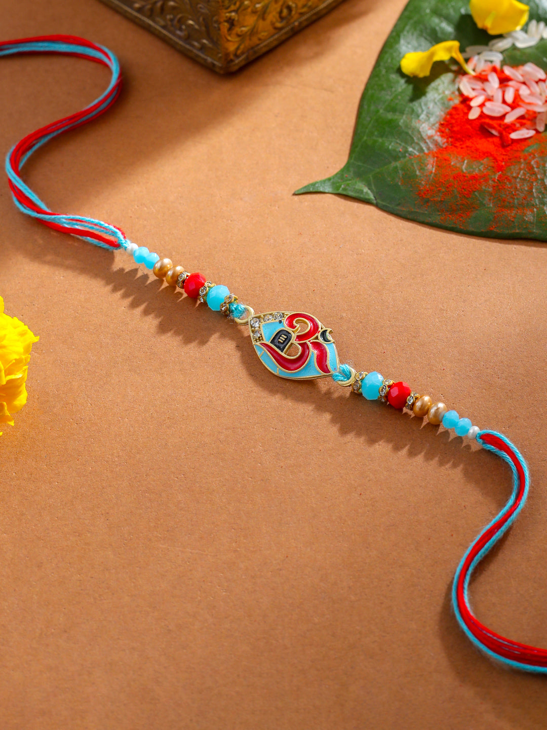 NVR Men Red & Blue Artificial Stones and Beads Om Thread Rakhi with Roli Chawal Chandan & Mishri - Swadesiicart