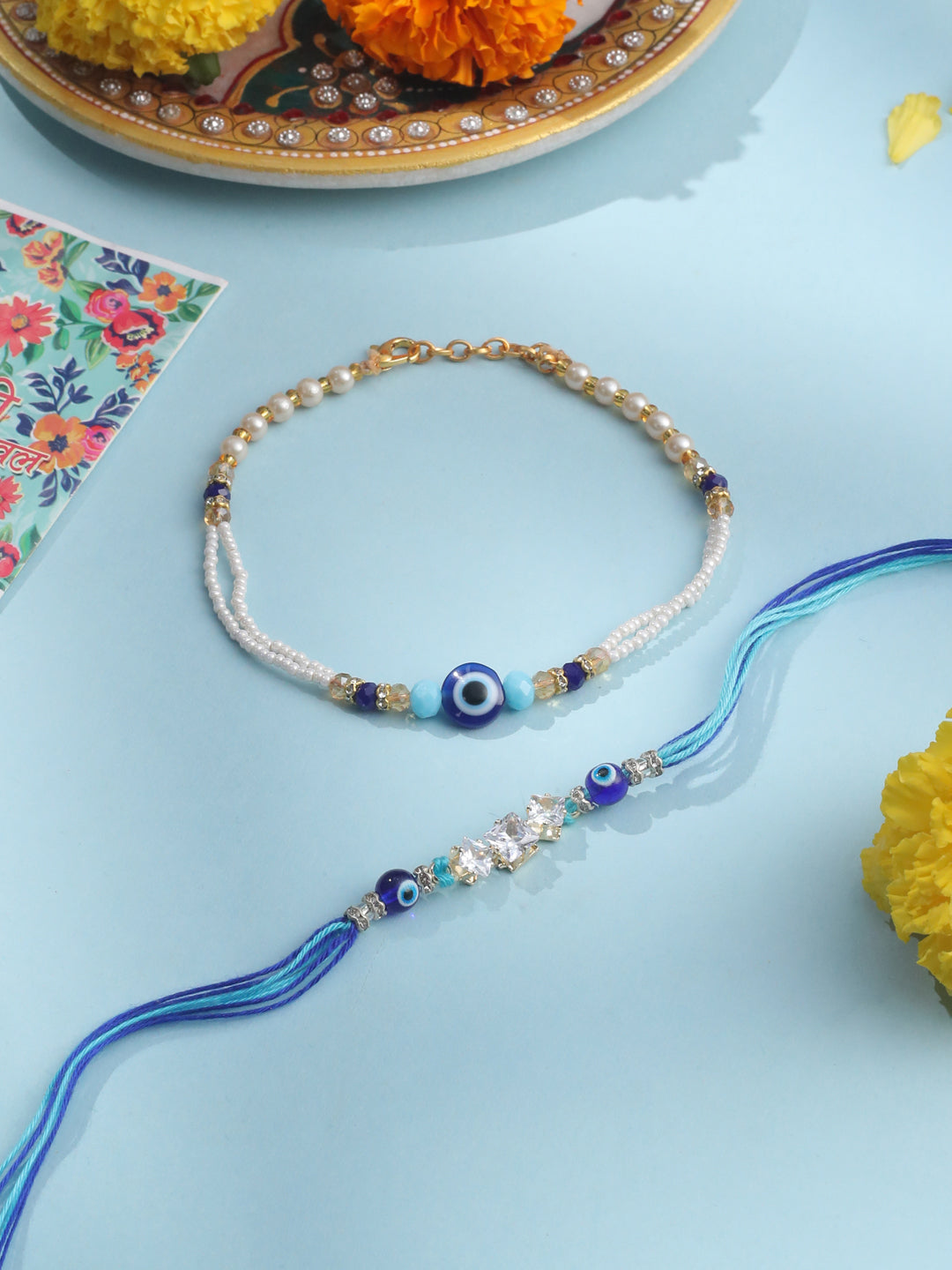NVR Set of 2 Blue Evil Eye Artificial Stones & Beads Bhaiya Bhabhi Rakhi with Roli Chawal Chandan & Mishri | Swadesiicart