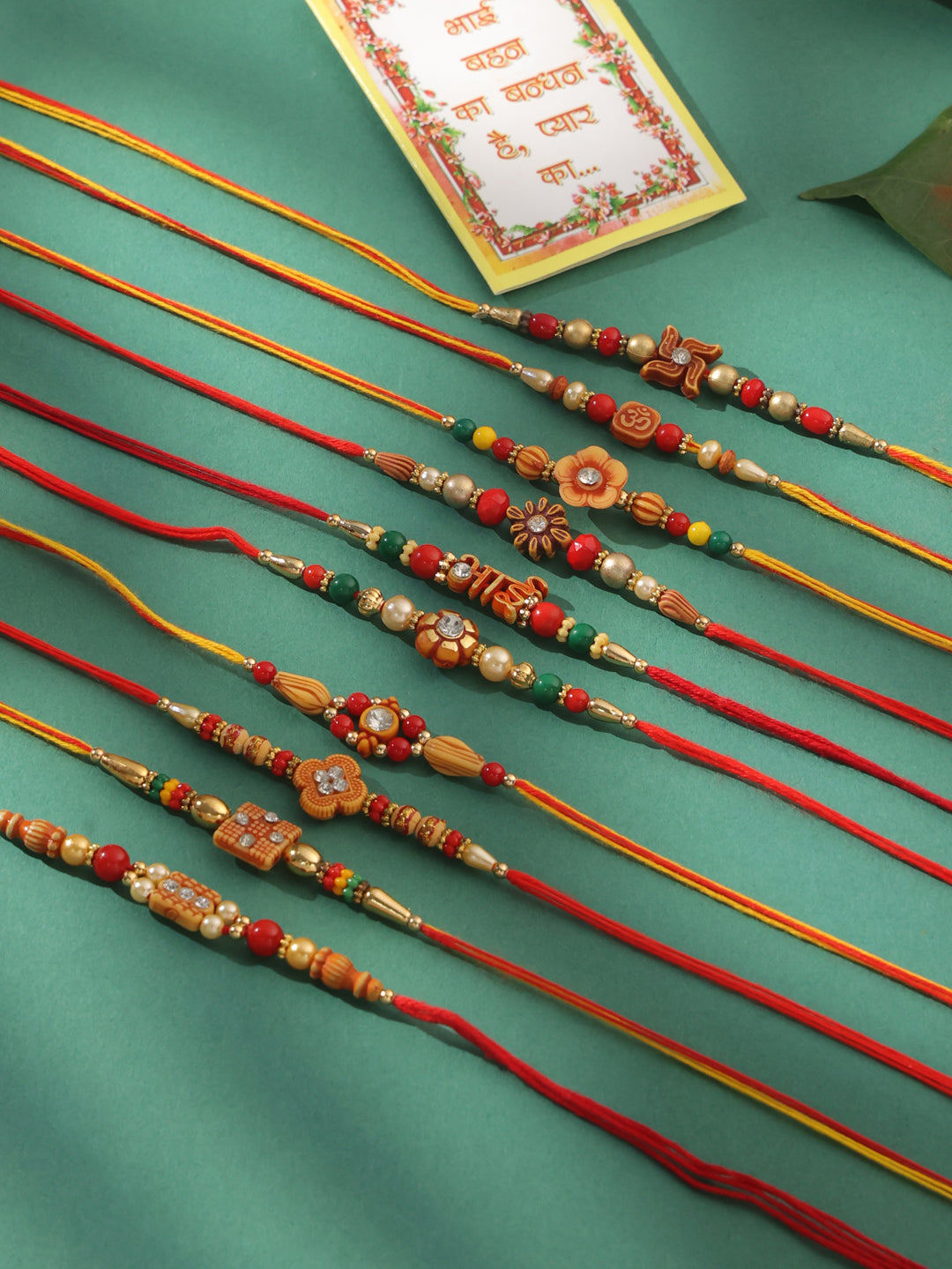 NVR Men Set of 10 Floral Design Red Artificial Stones and Beads Thread Rakhi with Roli Chawal Chandan & Mishri - Swadesiicart