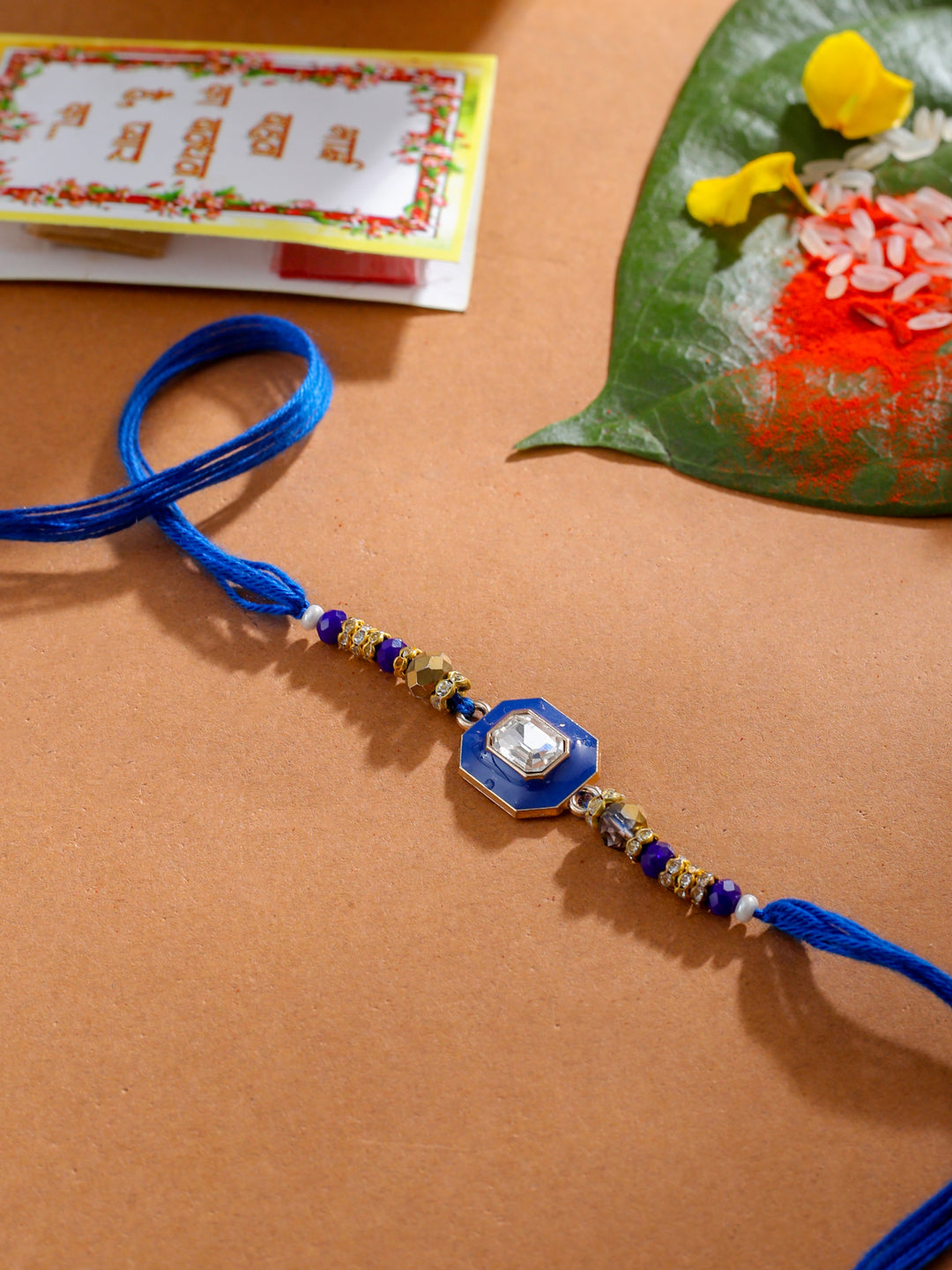 NVR Men Blue Artificial Stones Handmade Thread Rakhi with Roli Chawal Chandan & Mishri - Swadesiicart