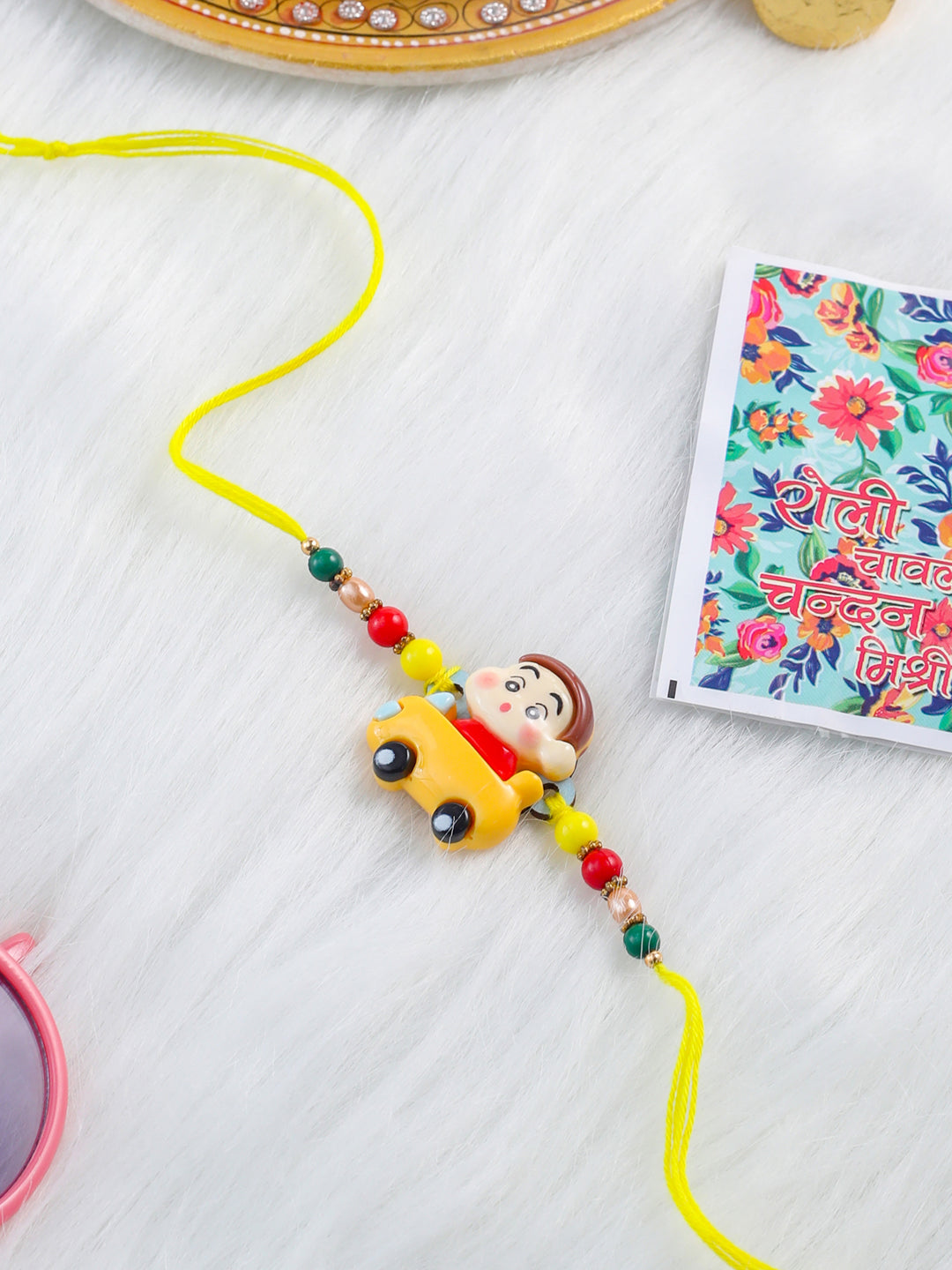 NVR Kids Yellow Cartoon Artificial Beads Rakhi with Roli Chawal Chandan & Mishri | Swadesiicart