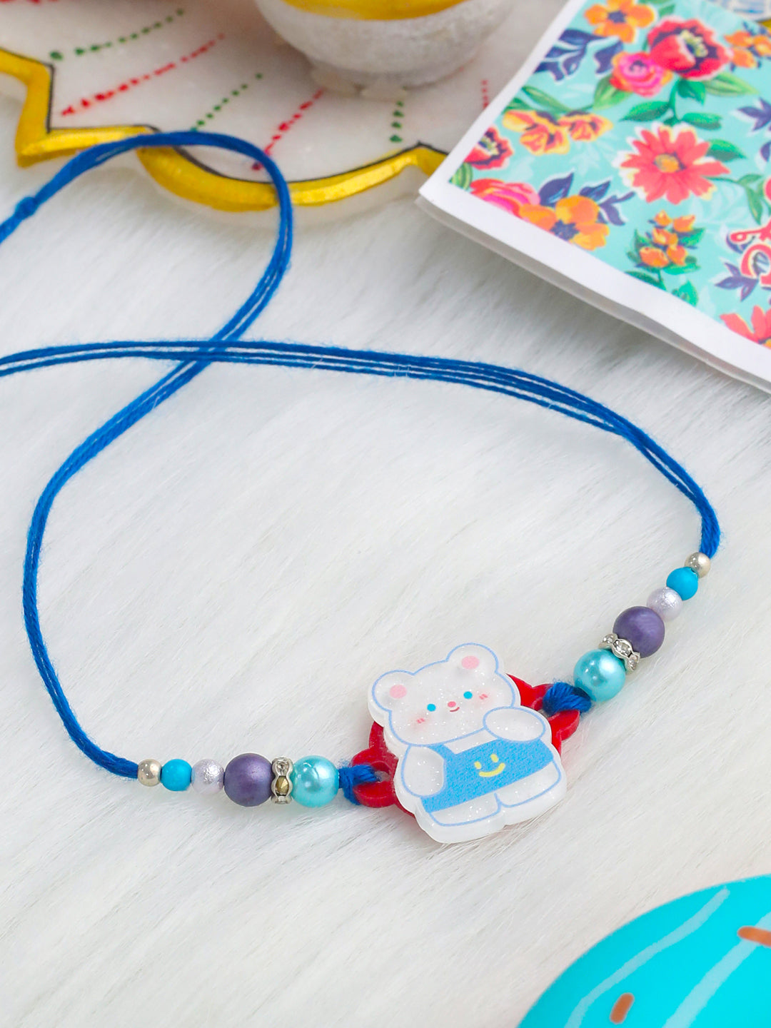 NVR Kids Teddy Blue Artificial Beads Thread Rakhi with Roli Chawal Chandan & Mishri - Swadesiicart