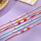 NVR Men Set of 6 Multicolor Pearls Thread Rakhi with Roli Chawal Chandan & Mishri | Swadesiicart