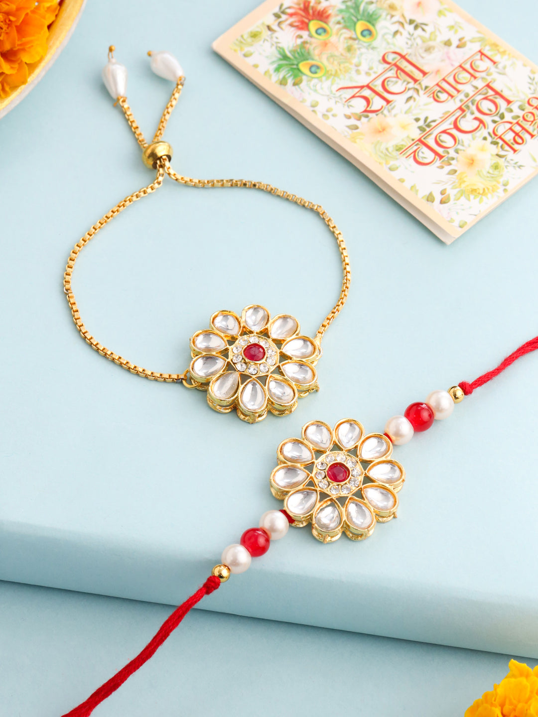 NVR Set of 2 Gold Toned Kundan Studded Floral Design Bhaiya Bhabhi Rakhi Set with Roli Chawal Chandan & Mishri | Swadesiicart
