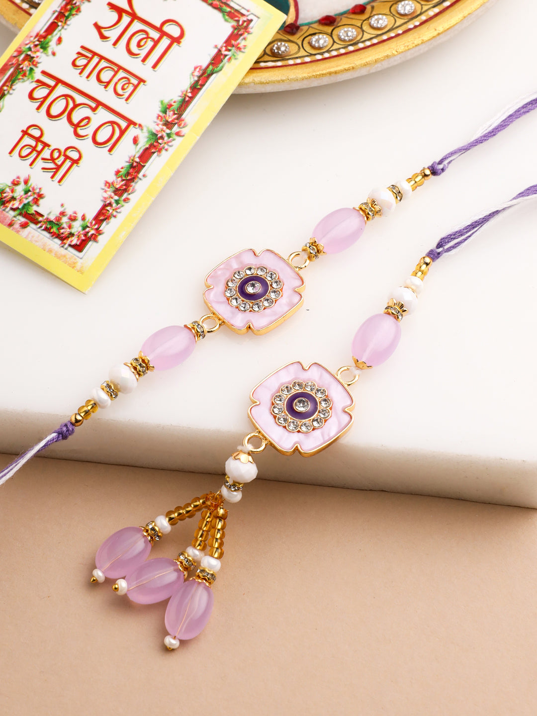 NVR Set of 2 Purple Artificial Stones & Beads Floral Design Thread Bhaiya Bhabhi Rakhi with Roli Chawal Chandan & Mishri | Swadesiicart