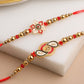 NVR Men Set of 2 Red & Gold Floral Design Artificial Beads Thread Rakhi With Roli Chawal Chandan & Mishri | Swadesiicart