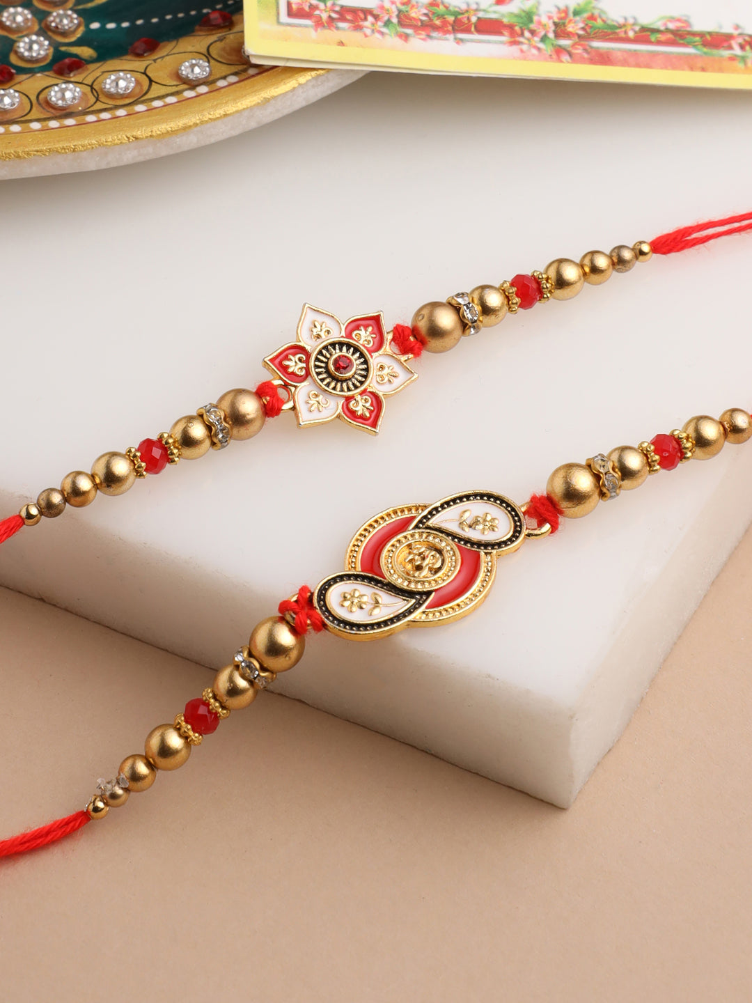NVR Men Set of 2 Red & Gold Floral Design Artificial Beads Thread Rakhi With Roli Chawal Chandan & Mishri | Swadesiicart