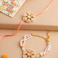 NVR Set of 2 Peach Color Artificial Stones & Pearls Bhaiya Bhabhi Rakhi With Roli Chawal Chandan & Mishri | Swadesiicart