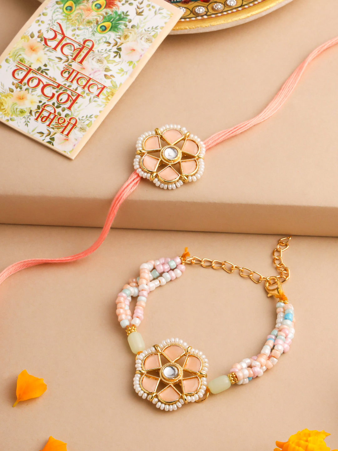 NVR Set of 2 Peach Color Artificial Stones & Pearls Bhaiya Bhabhi Rakhi With Roli Chawal Chandan & Mishri | Swadesiicart