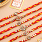 NVR Men Set of 6 Red & Yellow Kundan Studded Floral Design Thread Rakhi with Roli Chawal Chandan & Mishri | Swadesiicart
