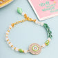 NVR Women Green Artificial Stones & Beads Floral Wraparound Rakhi with Roli Chawal Chandan & Mishri | Swadesiicart