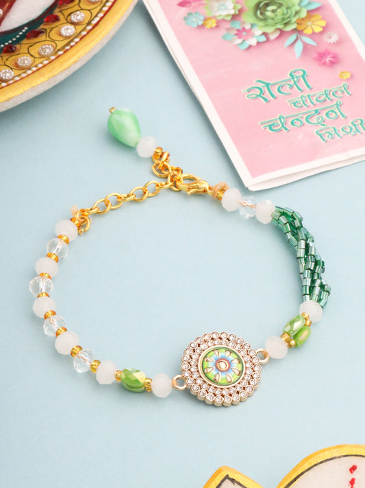 NVR Women Green Artificial Stones & Beads Floral Wraparound Rakhi with Roli Chawal Chandan & Mishri | Swadesiicart